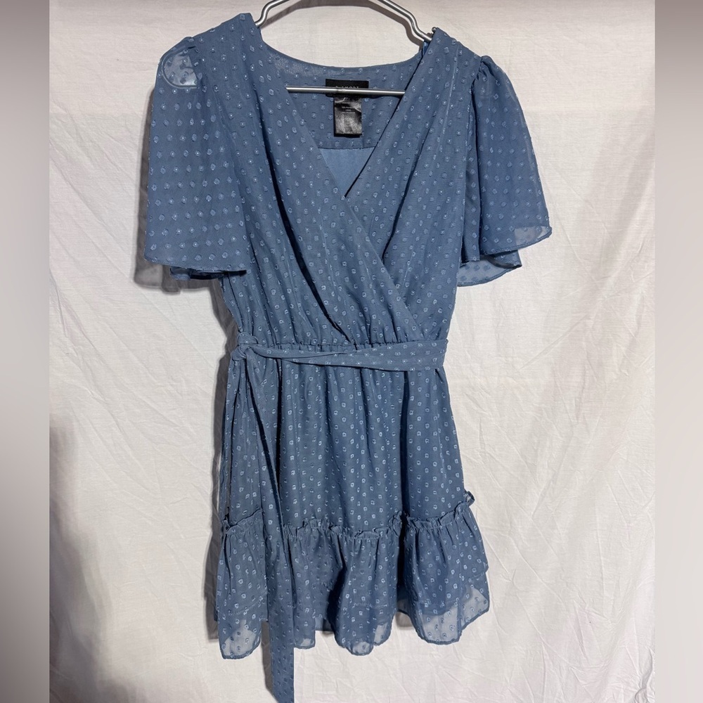 B. Smart blue swiss dot cross over top ruffle
hem dress Size Juniors 1